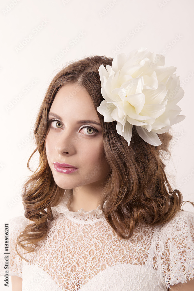 Naklejka premium girl in white dress and with white flower in her hair
