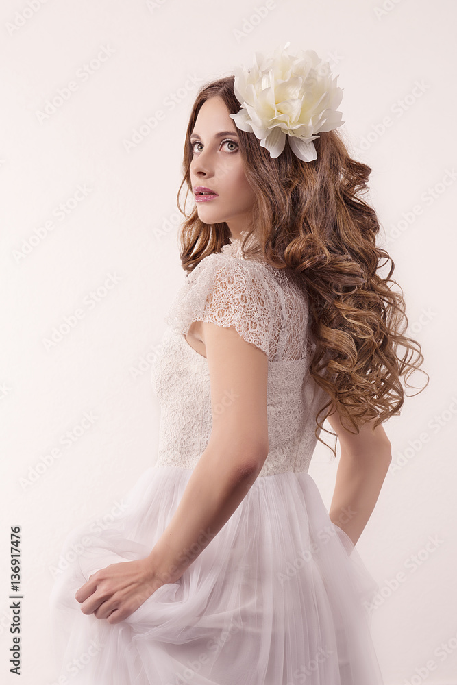 girl in white dress and with white flower in her hair girl in white dress and with white flower in her hair