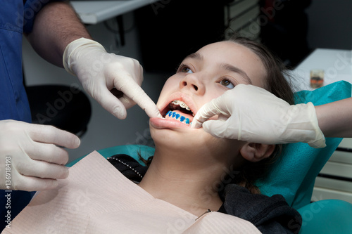 Girl by her dentist