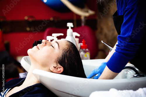 young woman at hairdreser in hair studio photo