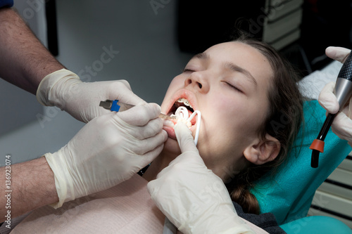 Girl by her dentist