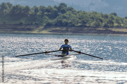 single rower at sunrise