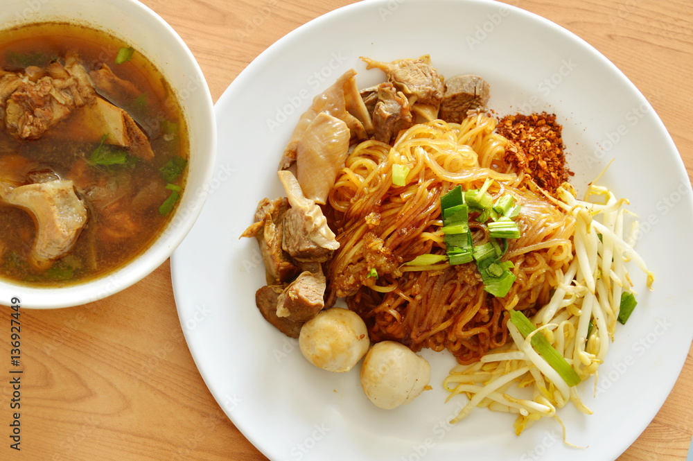 dried thin rice noodle topping braised pork and brown bone soup dried thin rice noodle topping braised pork and brown bone soup