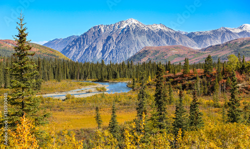 Fototapeta Naklejka Na Ścianę i Meble -  Scenic fall landscape with river and snow-capped mountains in Denali National Park, Alaska 