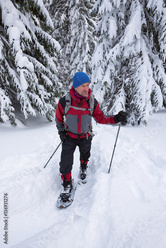 Traveler goes in snowshoes - adventure in the wild