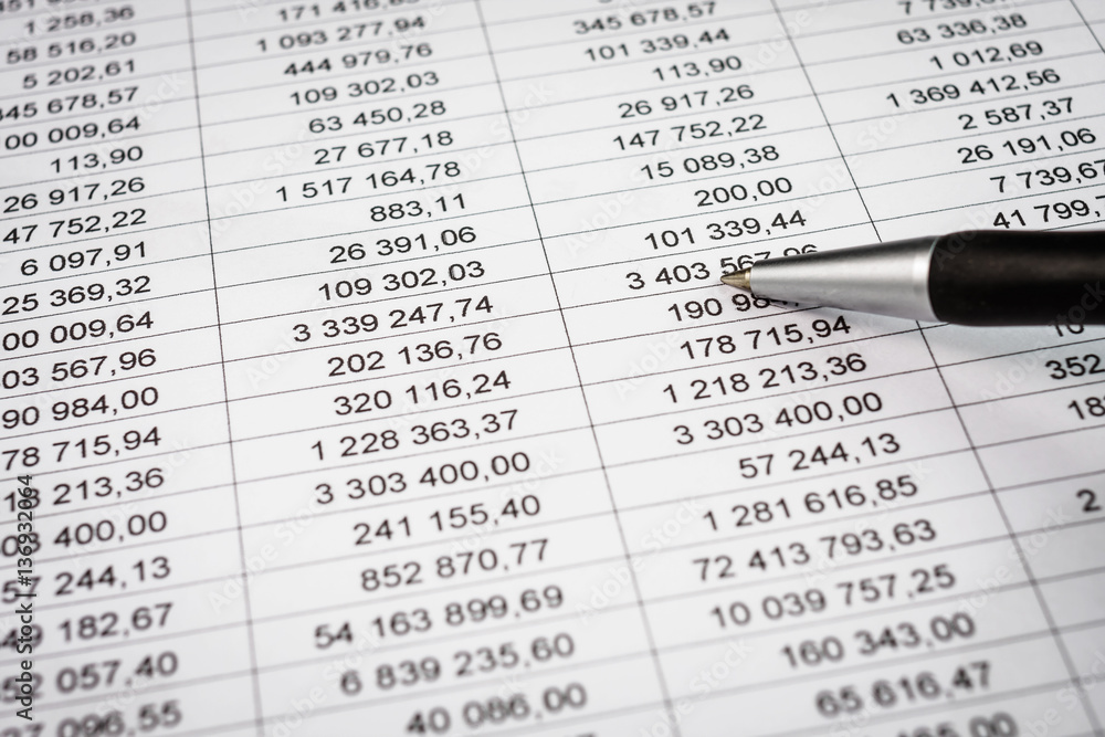 Businessman showing a diagram on a financial report using a pen Businessman showing a diagram on a financial report using a pen