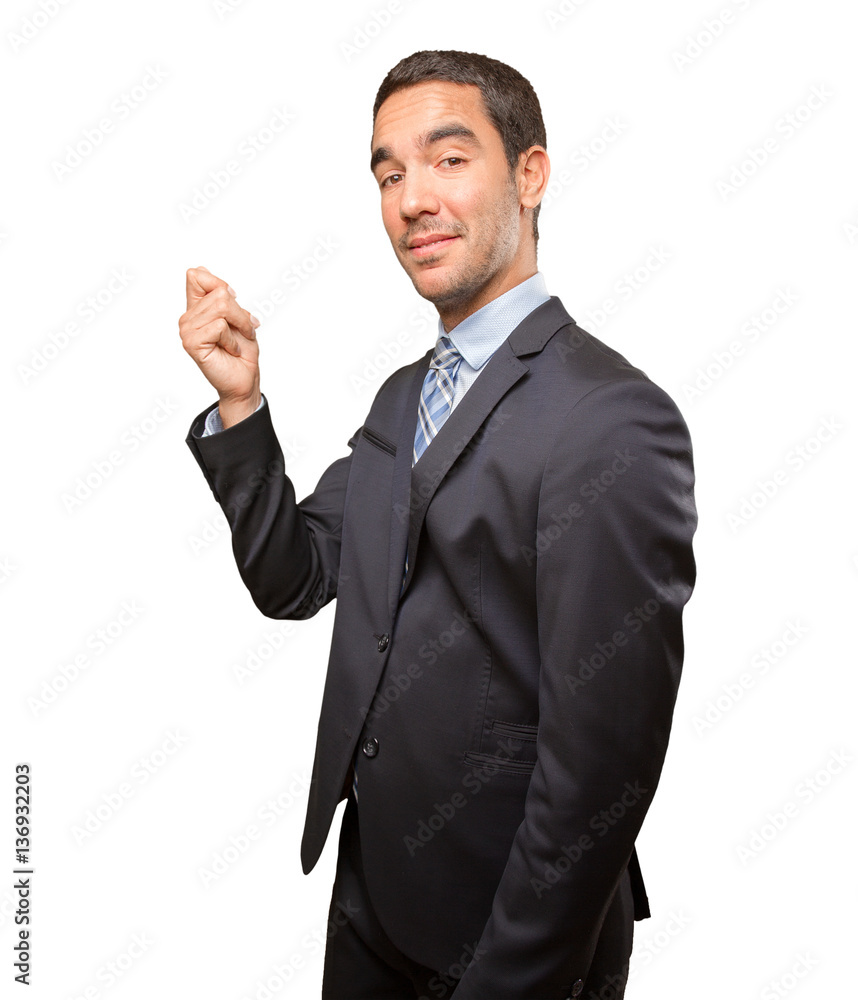 Happy young businessman doing a money gesture Happy young businessman doing a money gesture
