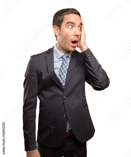 Astonished young businessman with his mouth open