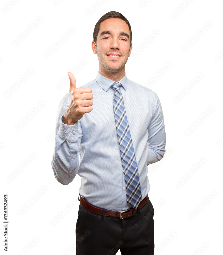 Satisfied young businessman doing an approval gesture Satisfied young businessman doing an approval gesture