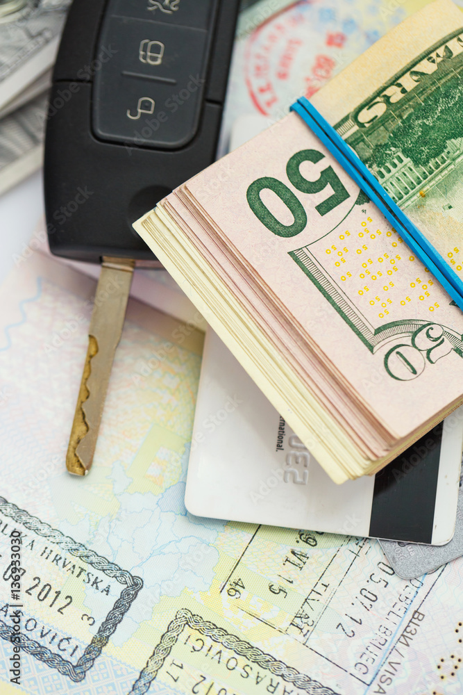 Fototapeta premium American money, credit cards and car key lies on thr top of the