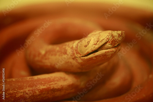 Snake sculpture from over 4,000 years ago, Mycenae, The Peloponnese, Greece, May 2009 photo