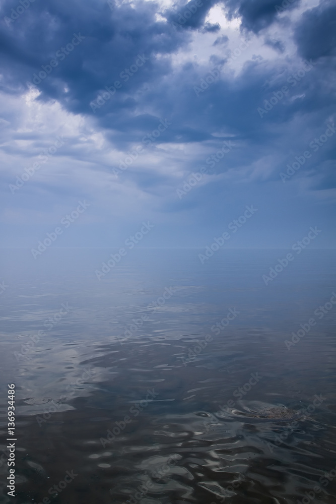 Stormy sky over calm sea Stormy sky over calm sea