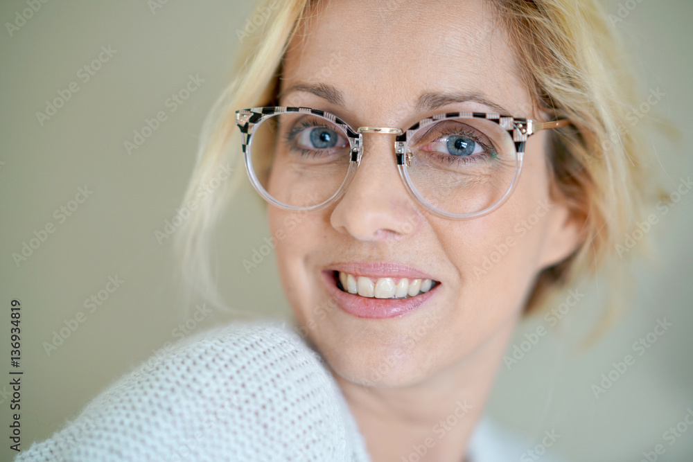 Fototapeta premium Potrait of beautiful blond woman with eyeglasses, isolated