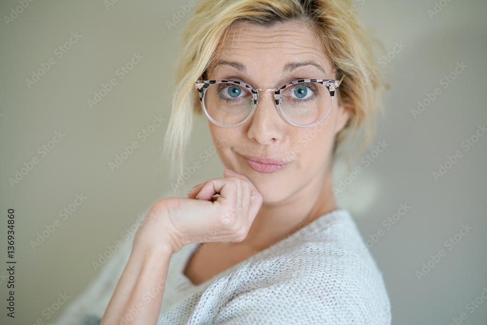 Potrait of beautiful blond woman with eyeglasses, isolated