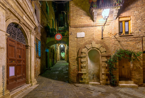 Fototapeta Naklejka Na Ścianę i Meble -  Medieval narrow cozy street in Siena, Tuscany, Italy