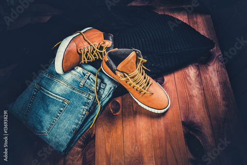 Men's Clothing yellow running shoes on a wooden background