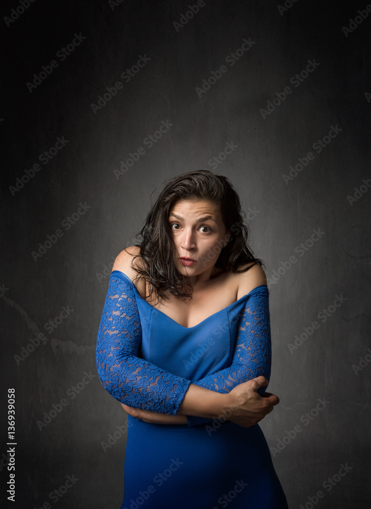 woman embracing body with arms woman embracing body with arms