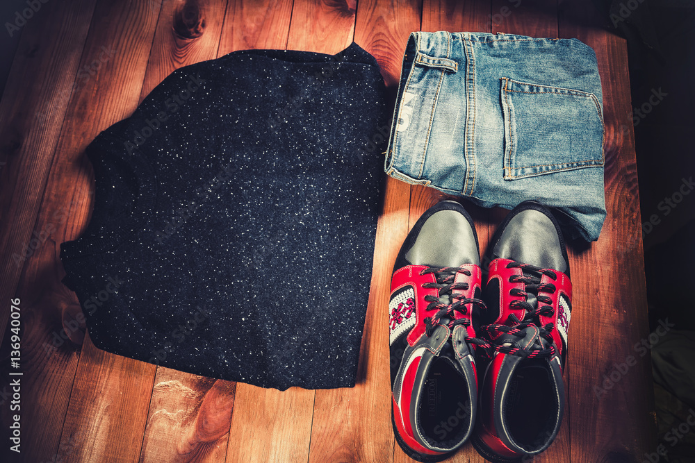 men's clothing, red sneakers on a wooden background, men's clothing, red sneakers on a wooden background,