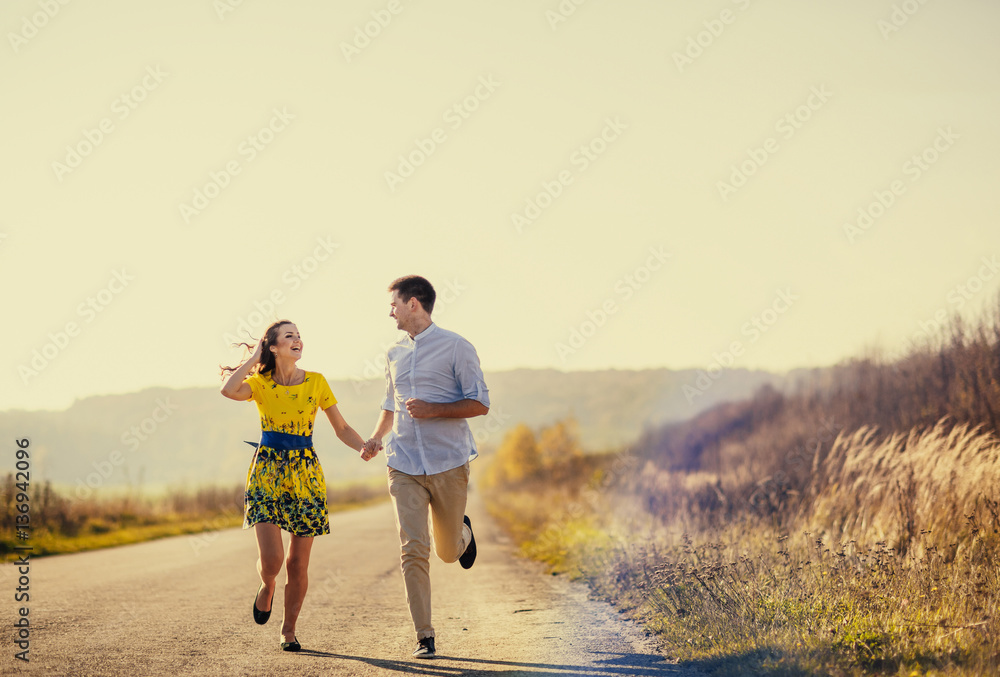 Brides running along the road Brides running along the road