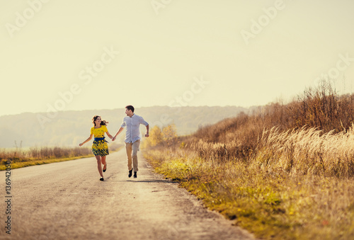 Brides running along the road