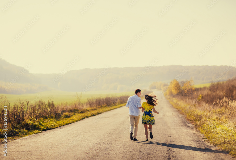 Fototapeta premium Brides running along the road