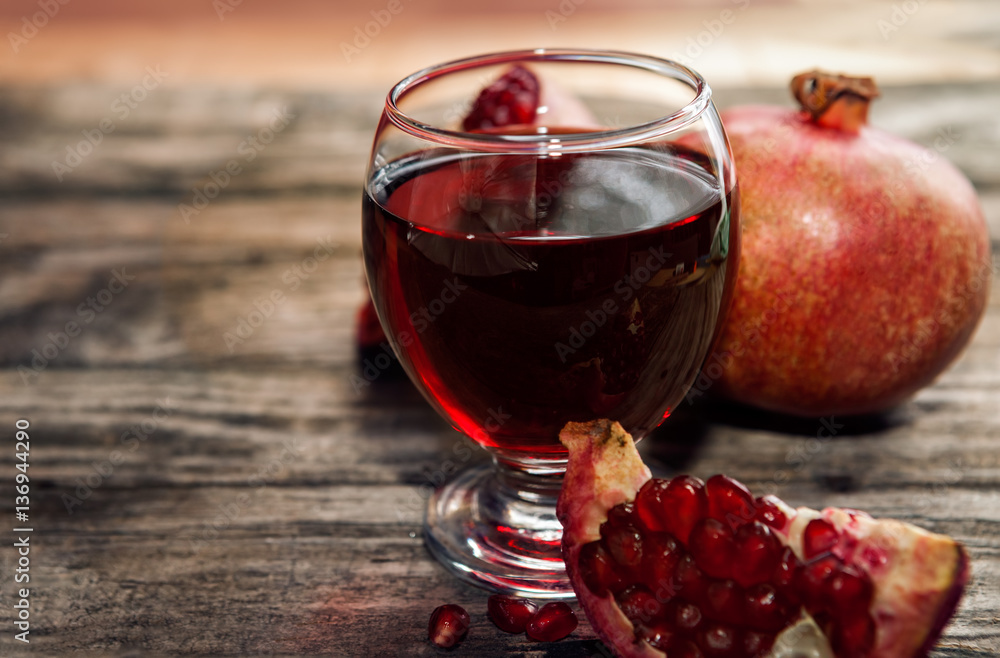 Freshly made pomegranate juice in glass Freshly made pomegranate juice in glass