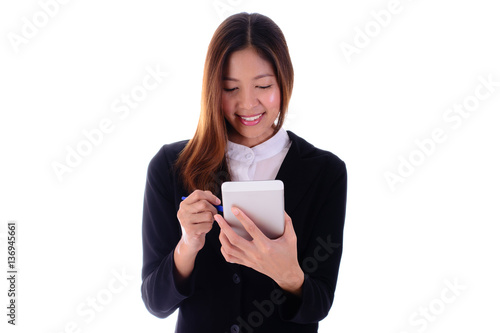 Smiling businesswoman using tablet on white background.