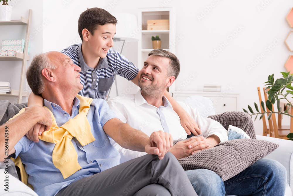 Boy hugging his family Boy hugging his family