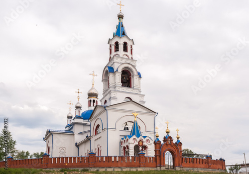Church of the Dormition at cloudy summer day. Novoutkinsk, Russi
