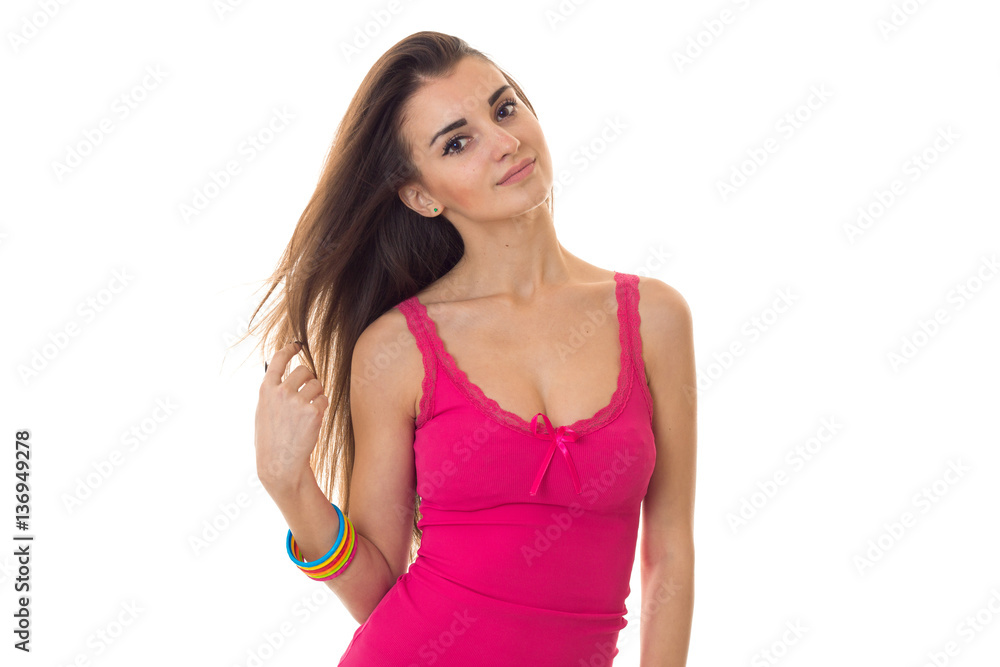 portrait of beautiful brunette girl in light summer clothes with big natural breasts posing and looking at the camera isolated on white background portrait of beautiful brunette girl in light summer clothes with big natural breasts posing and looking at the camera isolated on white background