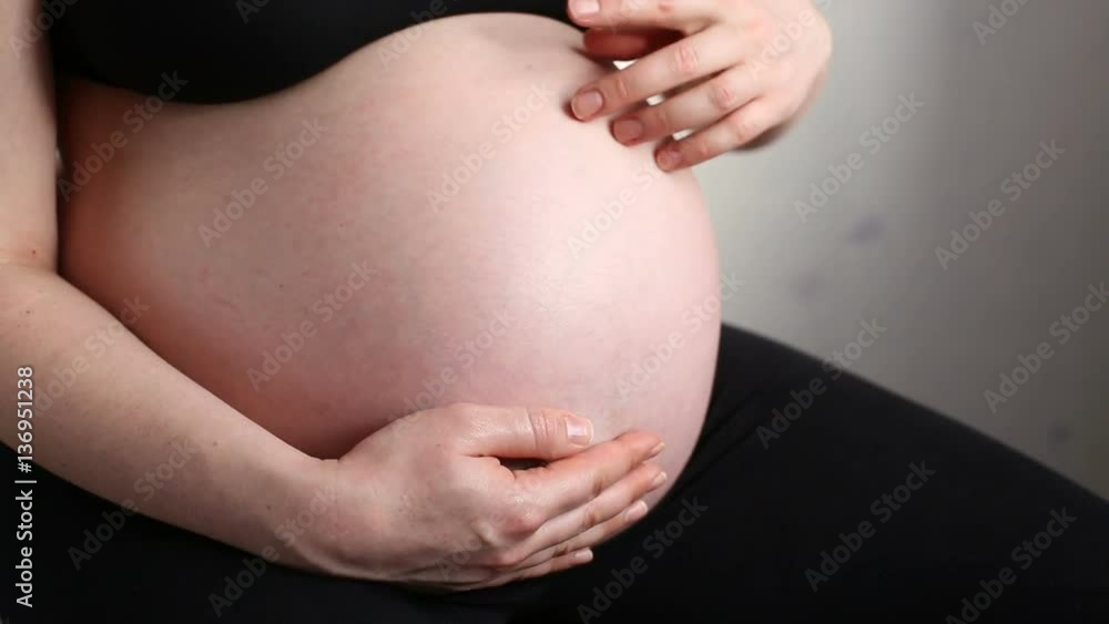 A Pregnant Woman Stroking Belly A Pregnant Woman Stroking Belly