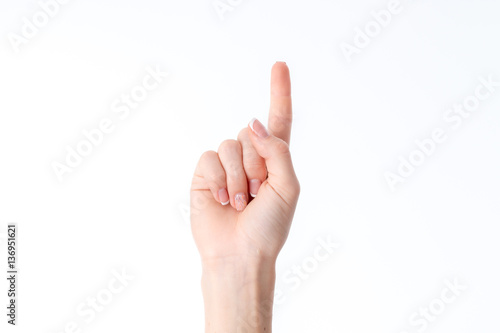 female hand showing the gesture with raised up one finger isolated on white background