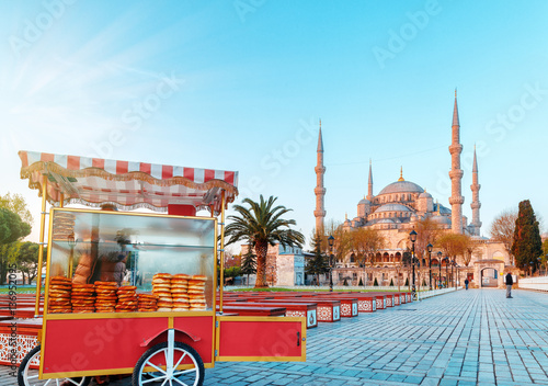 Traditional turkish fast food cart at Blue Mosque Cami background. Morning scene. Classical Istanbul scene, Turkey.