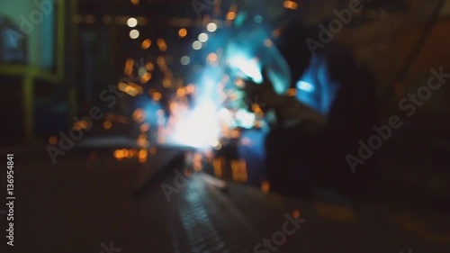 Welder of Metal Welding with sparks and smoke in  manufacturing slow motion