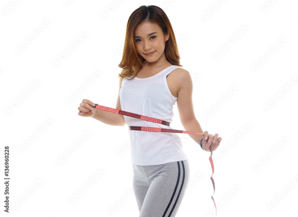 slimming woman measuring her thigh with measuring tape over whit slimming woman measuring her thigh with measuring tape over whit
