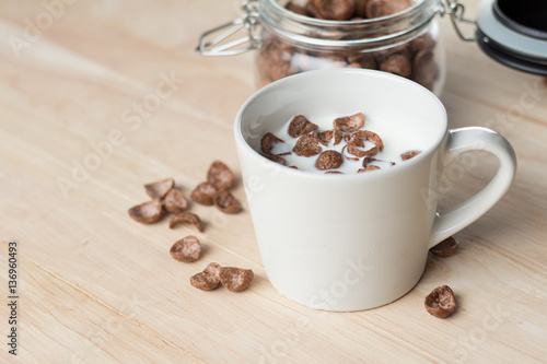 chocolate cereal cornflakes and milk for breafast photo