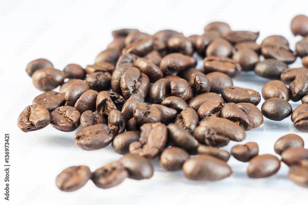 Photo macro coffee beans on a white background. Photo macro coffee beans on a white background.