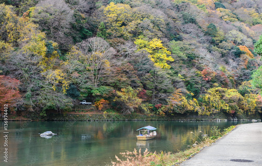 Autumn color of Asashiyama mountain and Oigawa river in Kyoto, Japan