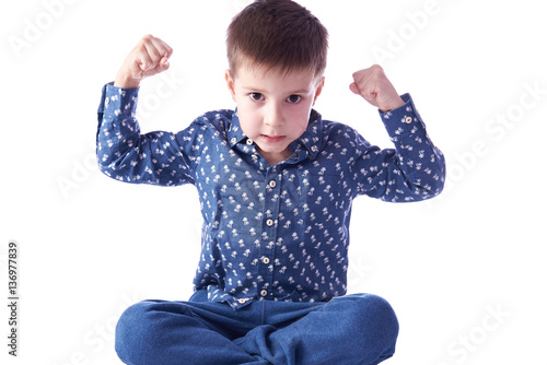 Quadro em tela Aggressive boy demostrates how strong he is.