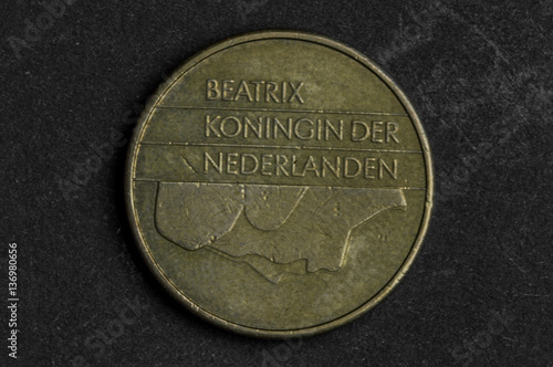 Close up of 5 beatrix koningn der nederlanden coin on black background - business concept