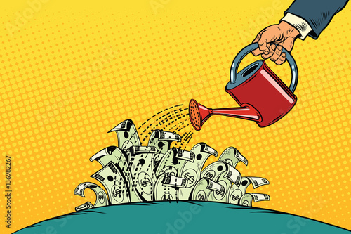 businessman watered money dollars from a watering can