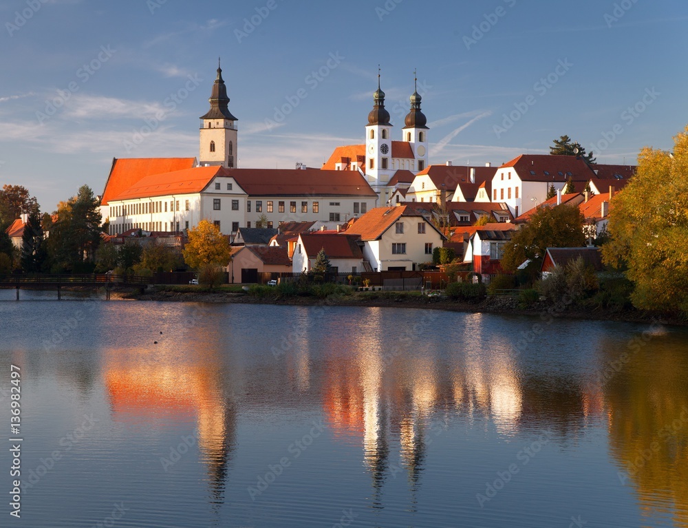 Evening view of Telc or Teltsch town mirroring in lake