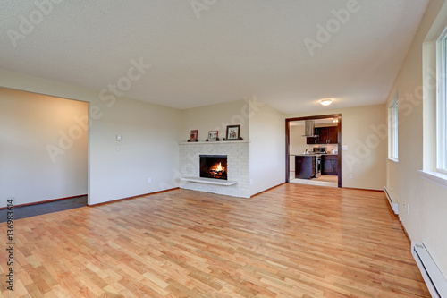 Empty spacious family room with fireplace