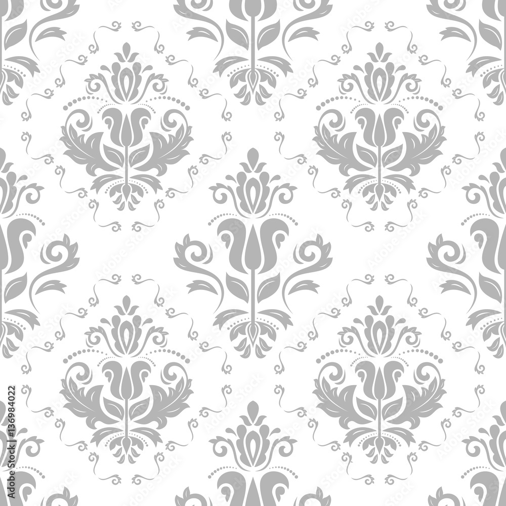 Elegant classic pattern. Seamless abstract background with repeating elements. Silver and white pattern