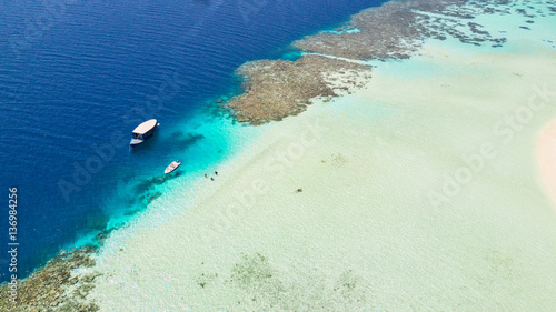 Beautiful coral reef with anchoring boats © Jag_cz