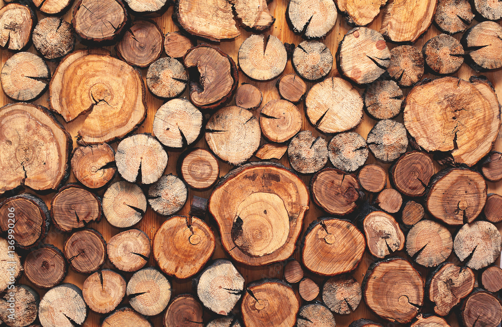 Abstract photo of a pile of natural wooden logs wall as background, top view Abstract photo of a pile of natural wooden logs wall as background, top view
