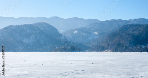frozen lake Bled many people on ice