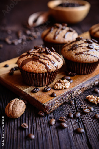 Coffee muffins with grated walnut and topped with chocolate