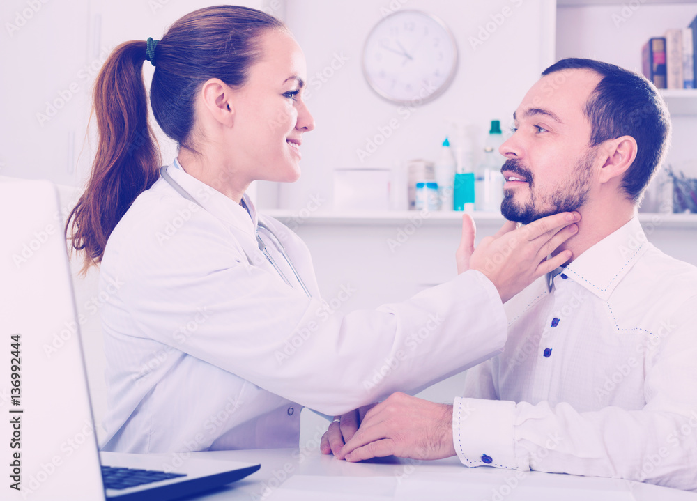 Fototapeta premium Man having consultation with female doctor in hospital