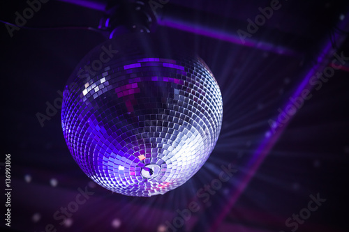 Disco ball with bright purple rays